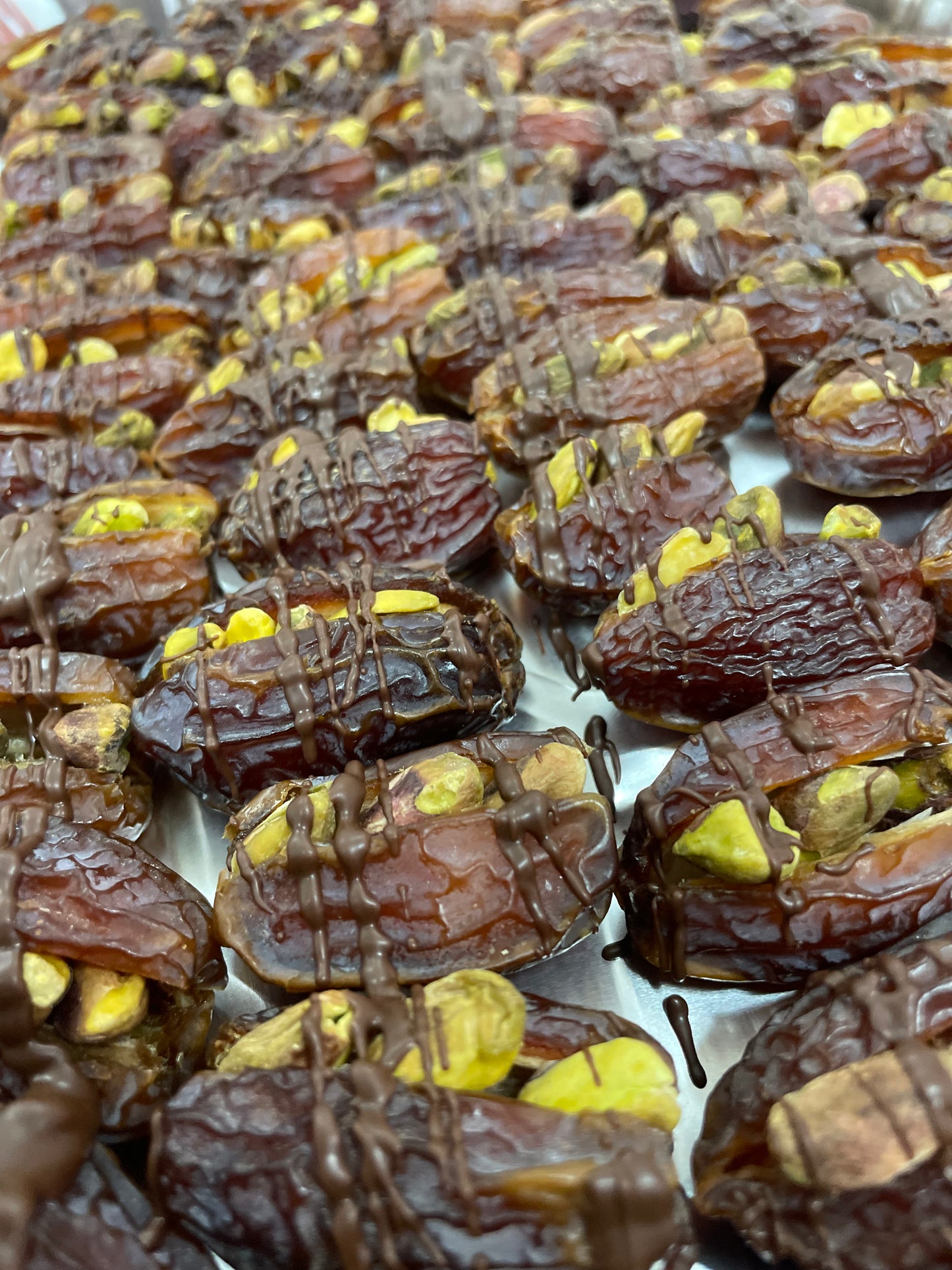 Pistachio Dates with dark chocolate drizzle